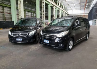 Two limousine vans both stylish black available as separate hires or for a combined group of 15