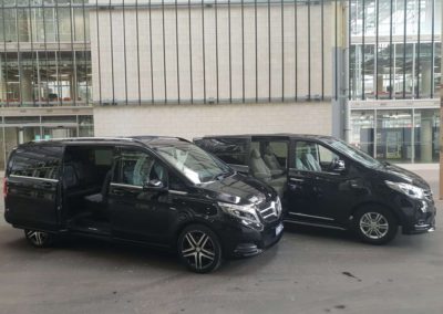 Two luxury vans from the Grandeur Limousine fleet demonstrating easy access for people of all ages